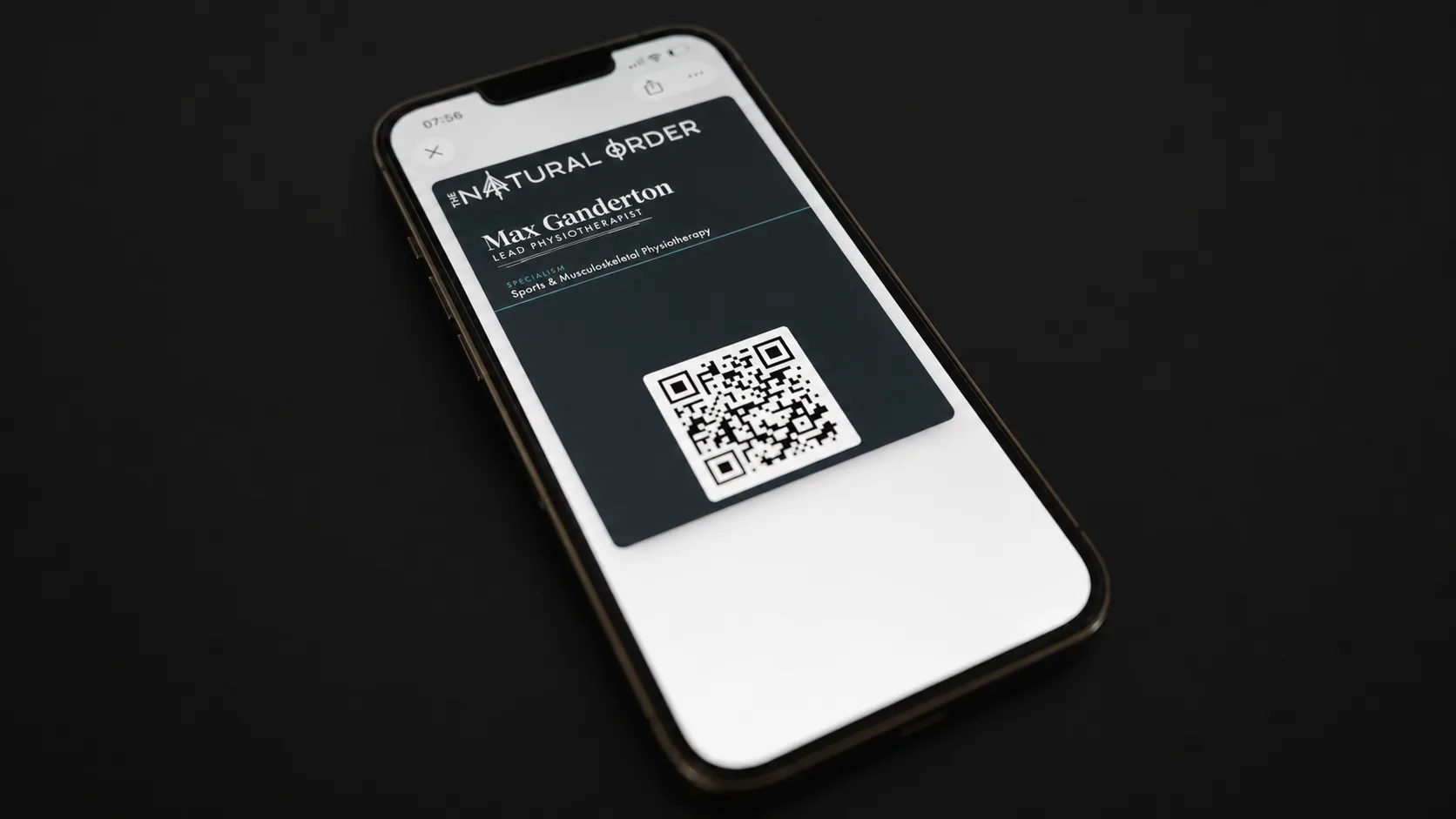 The Natural Order Apple Wallet business card on an iPhone