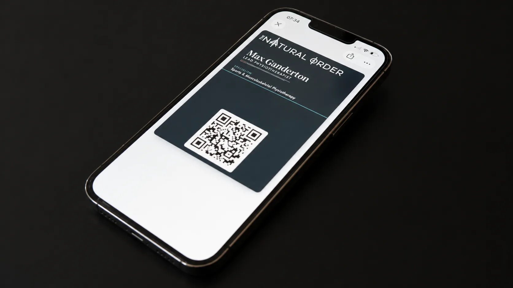 The Natural Order Apple Wallet business card on an iPhone
